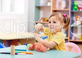 Little girl play in preschool