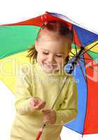 Cute child catching raindrops under umbrella