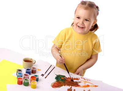 Cute child play with paints