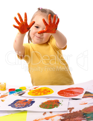 Cute child paint using hands