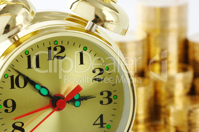 Time is money - clock dial and golden coins