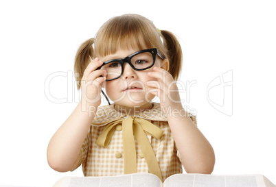 Happy little girl with book wearing black glasses