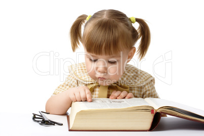 Cute little girl reading books, back to school