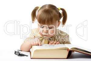 Cute little girl reading books, back to school