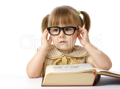 Cute little girl with book, back to school