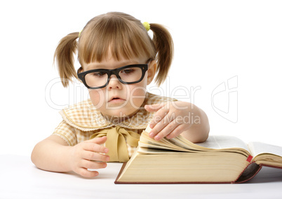 Cute little girl with book, back to school