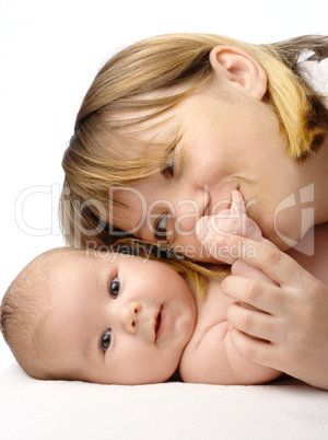 Mother kissing her child's hand