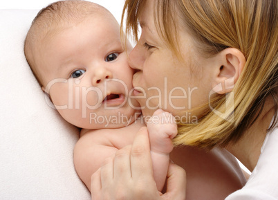 Mother kissing her child