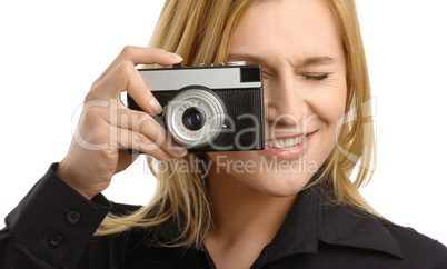 young woman taking a shot with photo camera