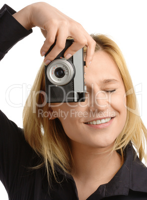 young woman taking a shot with photo camera