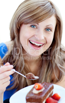 Radiant woman holding a piece of chocolate cake