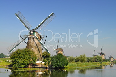 Dutch mills over a river