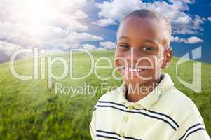 Handsome African American Boy Over Grass and Sky