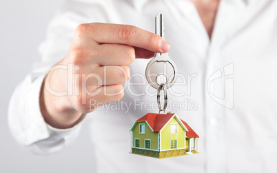 giving house key with a keychain house model form