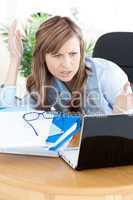 Stressed businesswoman looking at the laptop