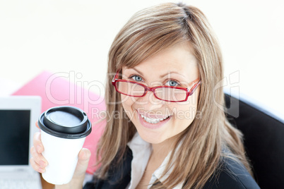 Beautiful businesswoman drinking coffee