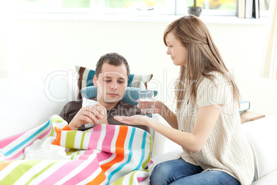 Positive woman taking care of her husband