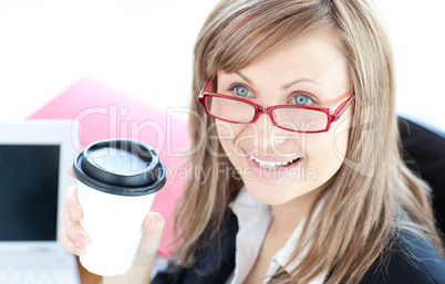 Bright businesswoman drinking coffee