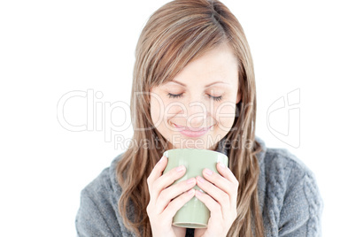 Smiling woman holding a cup a coffee