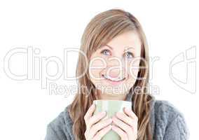 Joyful woman holding a cup a coffee