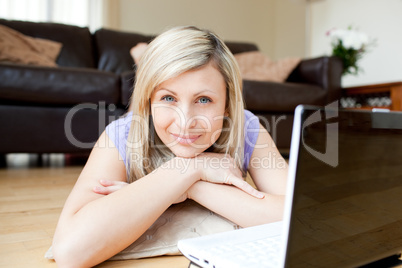 Bright woman using a laptop