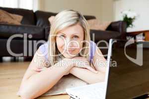 Bright woman using a laptop