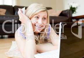 Radiant woman using a laptop