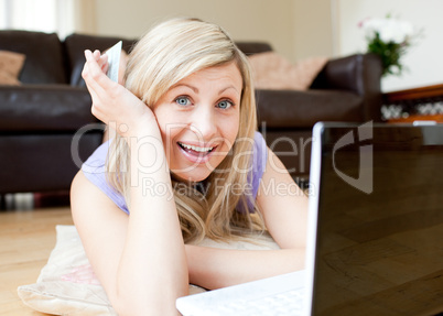 Joyful woman using a laptop