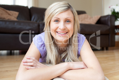 Portrait of a radiant woman lying on the floor