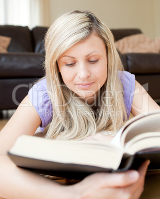 Cute woman reading a book