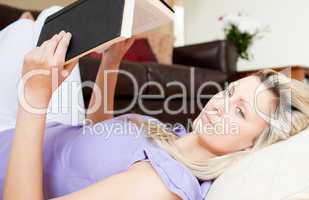Delighted woman reading a book