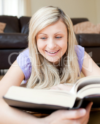 Happy woman reading a book