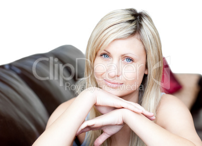 Portrait of a bright woman lying on the sofa