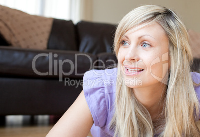 Portrait of a beautiful woman lying on the floor