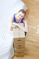 Attractive woman is moving various boxes