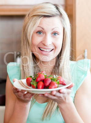 Joyful woman showing fruits