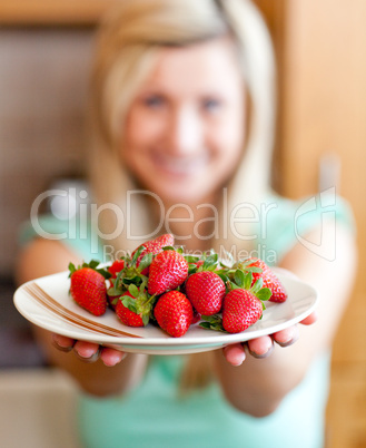 Positive woman showing fruits