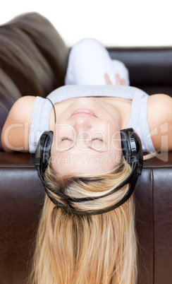 Radiant woman using headphones