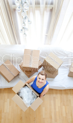 Young woman holding a box