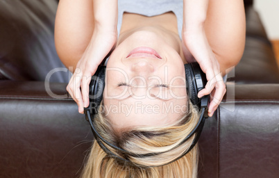 Calm woman using headphones