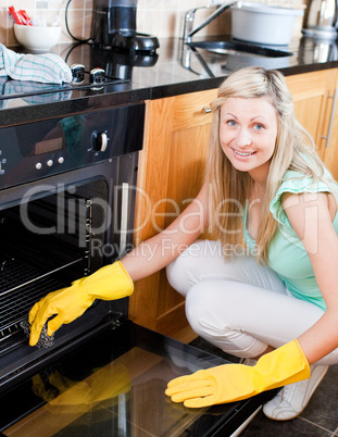 Portrait of a smiling housewife cleaning