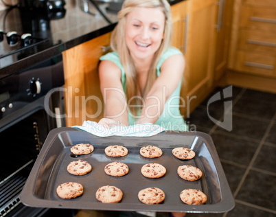 Smiling housewife preparing cookies