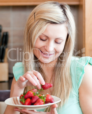 Positive woman eating fruits