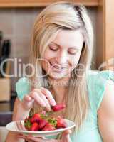 Positive woman eating fruits