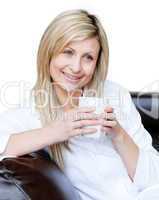 Lively woman holding a cup of coffee