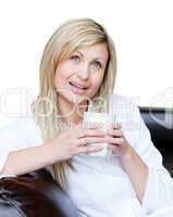 Smiling woman holding a cup of coffee