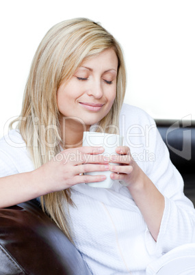 Cute woman holding a cup of coffee