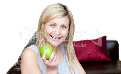 Radiant woman eating an apple