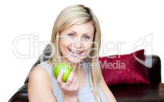 Radiant woman eating an apple