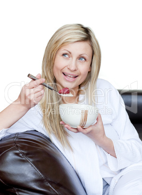 Delighted woman having a breakfast